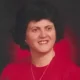 Woman in red top studio portrait