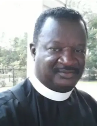 Man wearing clerical collar outdoors