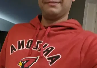 Man wearing Arizona Cardinals red hoodie