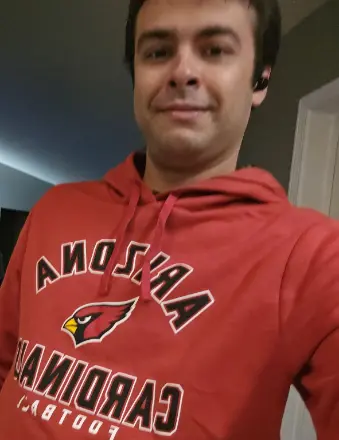 Man wearing Arizona Cardinals red hoodie