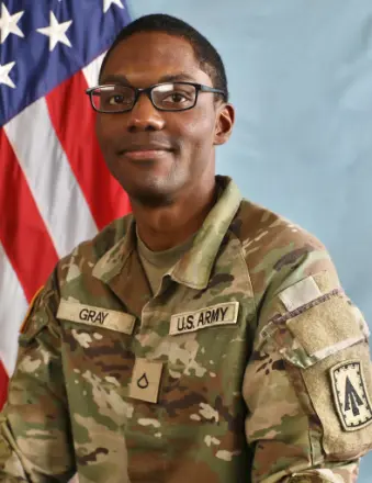 U.S. Army soldier in uniform with flag