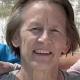 Smiling older woman outdoors in daylight