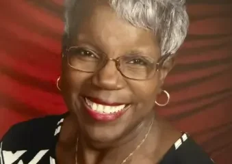Smiling older woman with glasses and gray hair