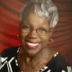 Smiling older woman with glasses and gray hair