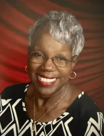 Smiling older woman with glasses and gray hair