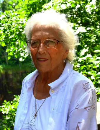 Elderly woman with white hair outdoors