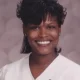 Smiling woman in white blouse studio portrait