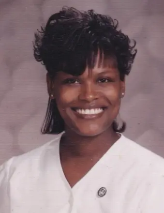 Smiling woman in white blouse studio portrait