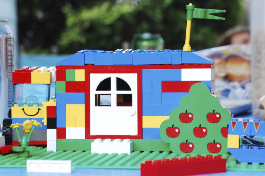 Colorful LEGO house with apple tree and truck