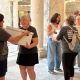 Women carrying document boxes inside marble capitol building