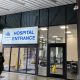 Hospital entrance with glass doors and signage