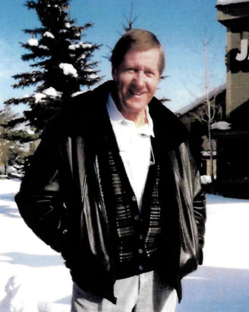 Man smiling outdoors in snowy winter setting