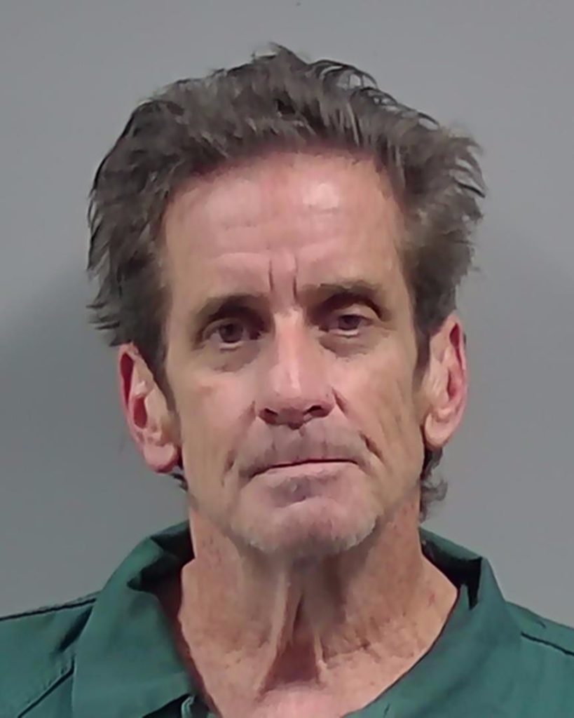 Portrait of middle-aged man in green shirt
