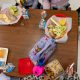 Children eating school lunch at cafeteria table
