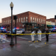 Police investigate downtown crime scene at dusk