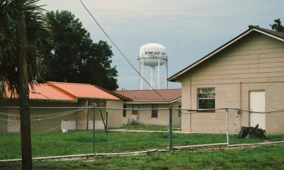 Small houses with water tower in background