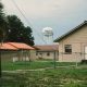 Small houses with water tower in background