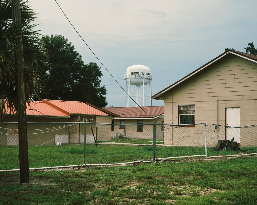 Small houses with water tower in background