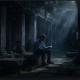 Man reading book in ancient stone ruins