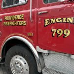 Close-up of a red fire truck with 'Providence Firefighters' and 'Engine 799' insignia, show — fire truck antitrust lawsuit