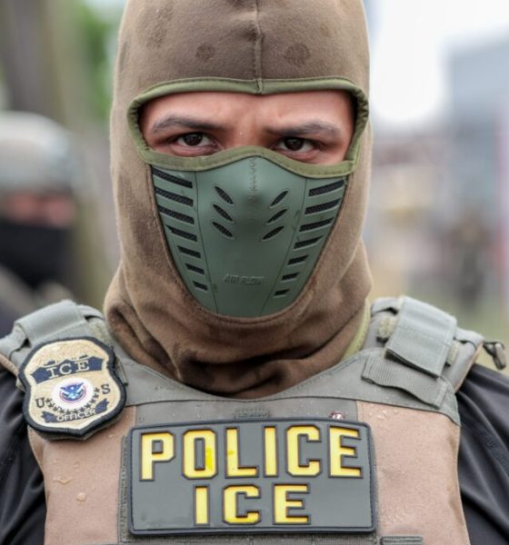 An ICE officer in tactical gear with a mask, focusing on immigration enforceme — immigration enforcement houses of worship
