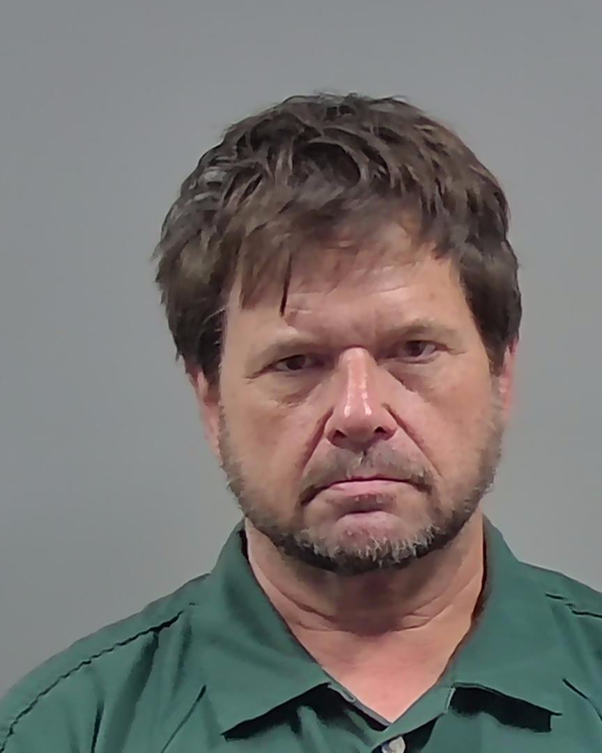 Middle-aged man in green shirt portrait