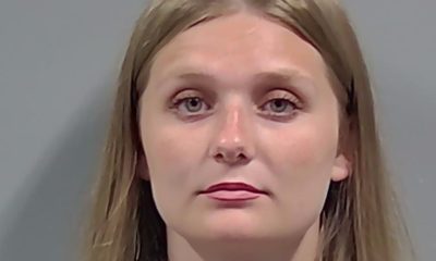 Portrait of a woman against a plain gray background