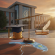 A scale balancing coins and a graduation cap against a backdrop of a college building, symbolizing affordability in educat…