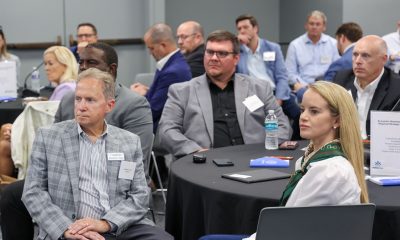 Attendees at the Pensacola workforce summit engaged in discussion and listening attentively.