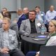 Attendees at the Pensacola workforce summit engaged in discussion and listening attentively.