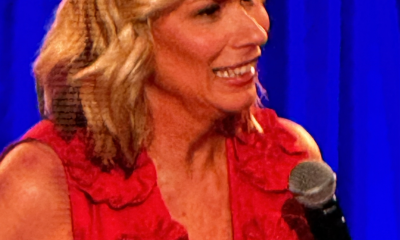 Smiling older woman speaking into a microphone onstage — Leanne Morgan Pensacola Bay Center