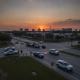 Emergency responders at sunset clearing a crash scene on Brent Lane in Pensacola, with vehicl — brent lane crash pensacola