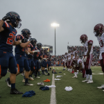 Escambia and Tate football players line up on the field, showcasing a tense moment befor — Escambia vs Tate Football Score