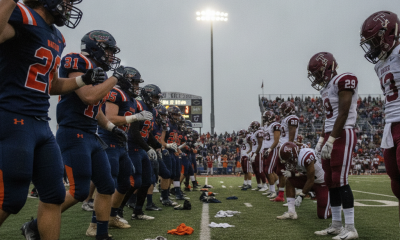 Escambia and Tate football players line up on the field, showcasing a tense moment befor — Escambia vs Tate Football Score