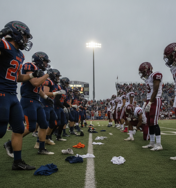Escambia and Tate football players line up on the field, showcasing a tense moment befor — Escambia vs Tate Football Score