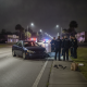 Police officers investigate a fatal pedestrian crash scene on North W St — Fatal Pedestrian Crash North W Street Pensacola