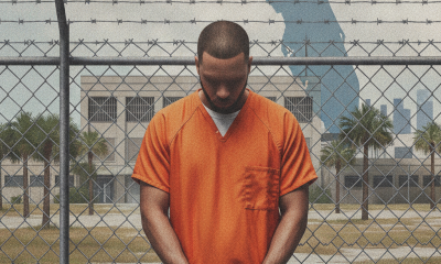 A man in an orange prison jumpsuit stands handcuffed in front of a Florida map si — illegal reentry federal prison Florida