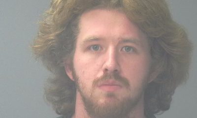 Mugshot-style portrait of a bearded man with long hair — Pensacola felon pleads guilty federal gun and drug charges