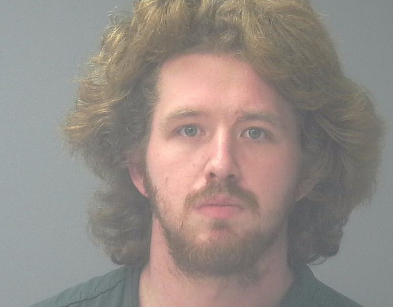 Mugshot-style portrait of a bearded man with long hair — Pensacola felon pleads guilty federal gun and drug charges