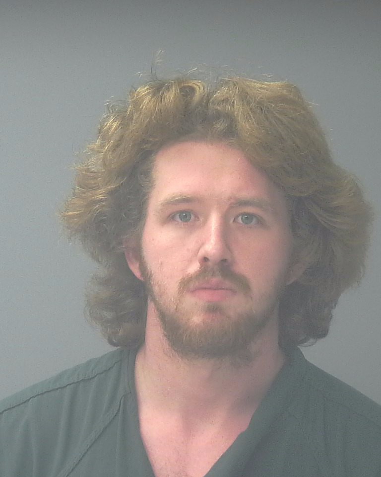 Mugshot-style portrait of a bearded man with long hair — Pensacola felon pleads guilty federal gun and drug charges