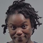 Close-up portrait of smiling man with short dreadlocks — Cantonment shed shooting