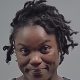 Close-up portrait of smiling man with short dreadlocks — Cantonment shed shooting