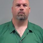 Eric Douglas McClure with goatee wearing a green collared shirt — Flomaton parents attempted murder