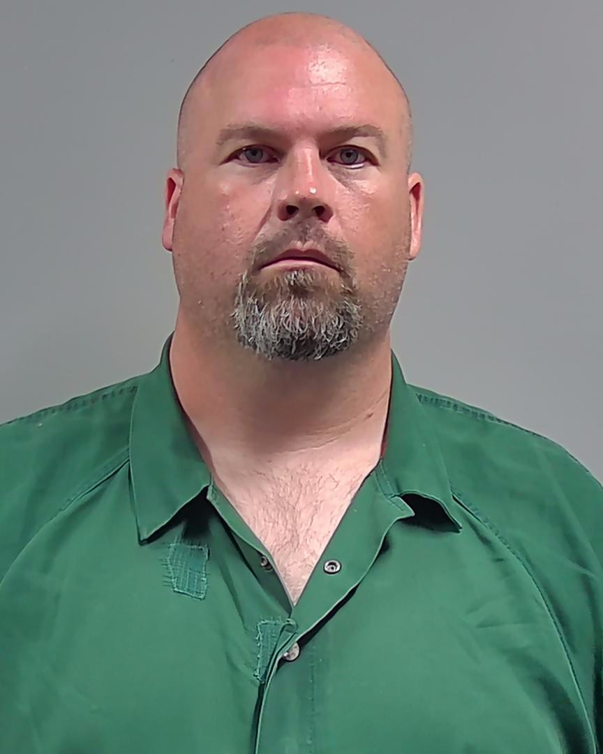 Eric Douglas McClure with goatee wearing a green collared shirt — Flomaton parents attempted murder