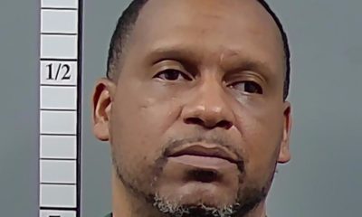 Mugshot-style portrait of man beside height chart — pensacola man sentenced federal drug charges