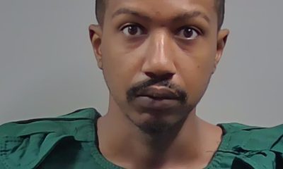 Man in green protective vest faces camera — Michael Anthony Hall Jr Arrest Cantonment