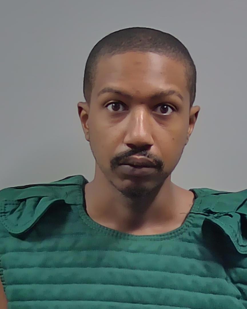 Man in green protective vest faces camera — Michael Anthony Hall Jr Arrest Cantonment