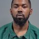 Close-up portrait of bearded man in green collared shirt — Pensacola Gas Station Murder Conviction