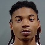 Close-up portrait of a young man with braided hair — Pensacola Postal Worker Marijuana Theft