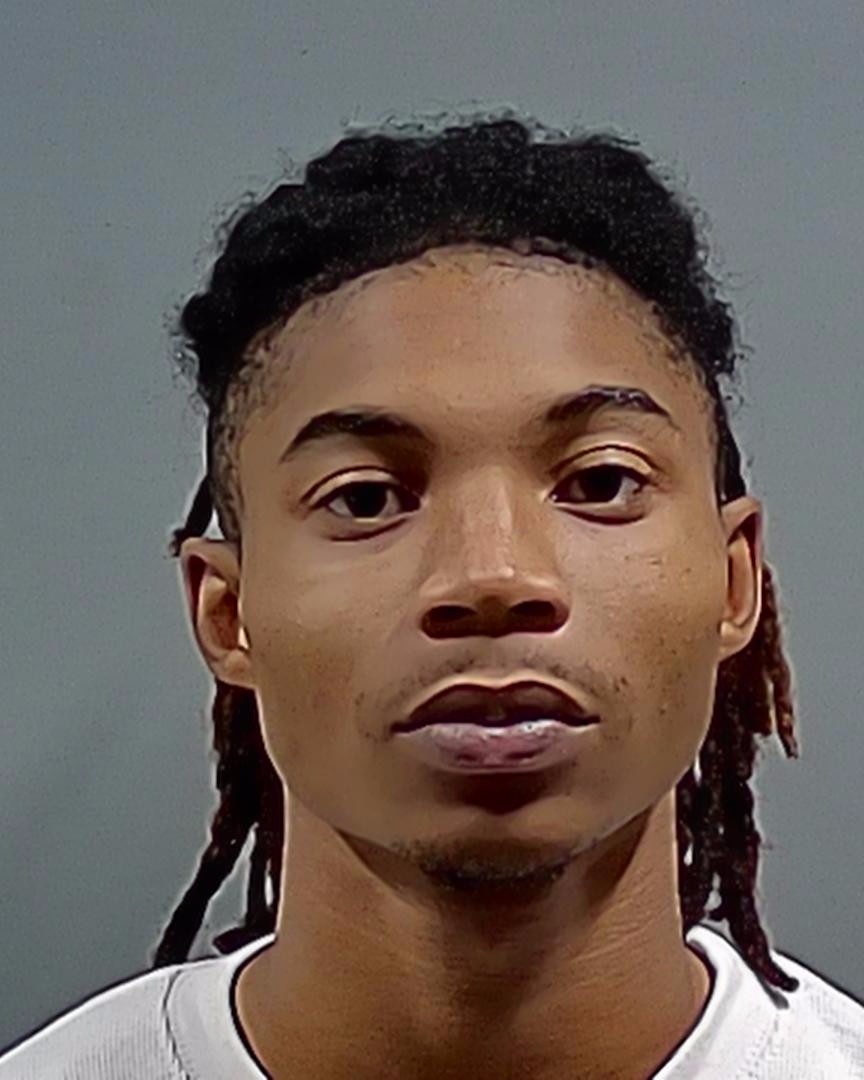 Close-up portrait of a young man with braided hair — Pensacola Postal Worker Marijuana Theft